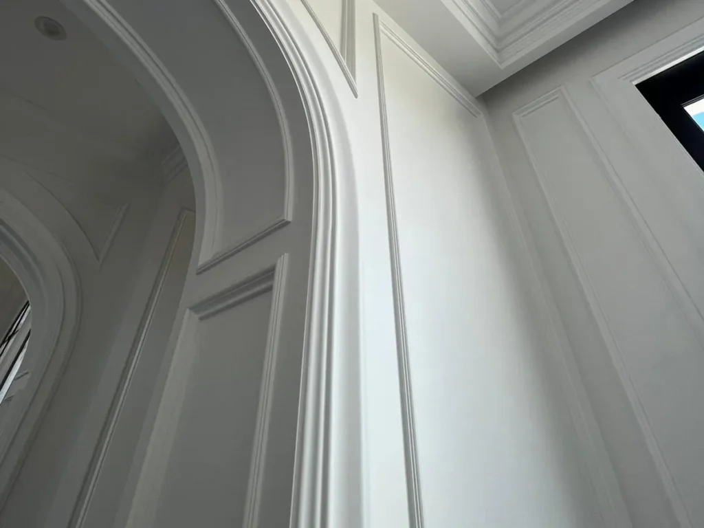 Elegant curved and paneled wall details.