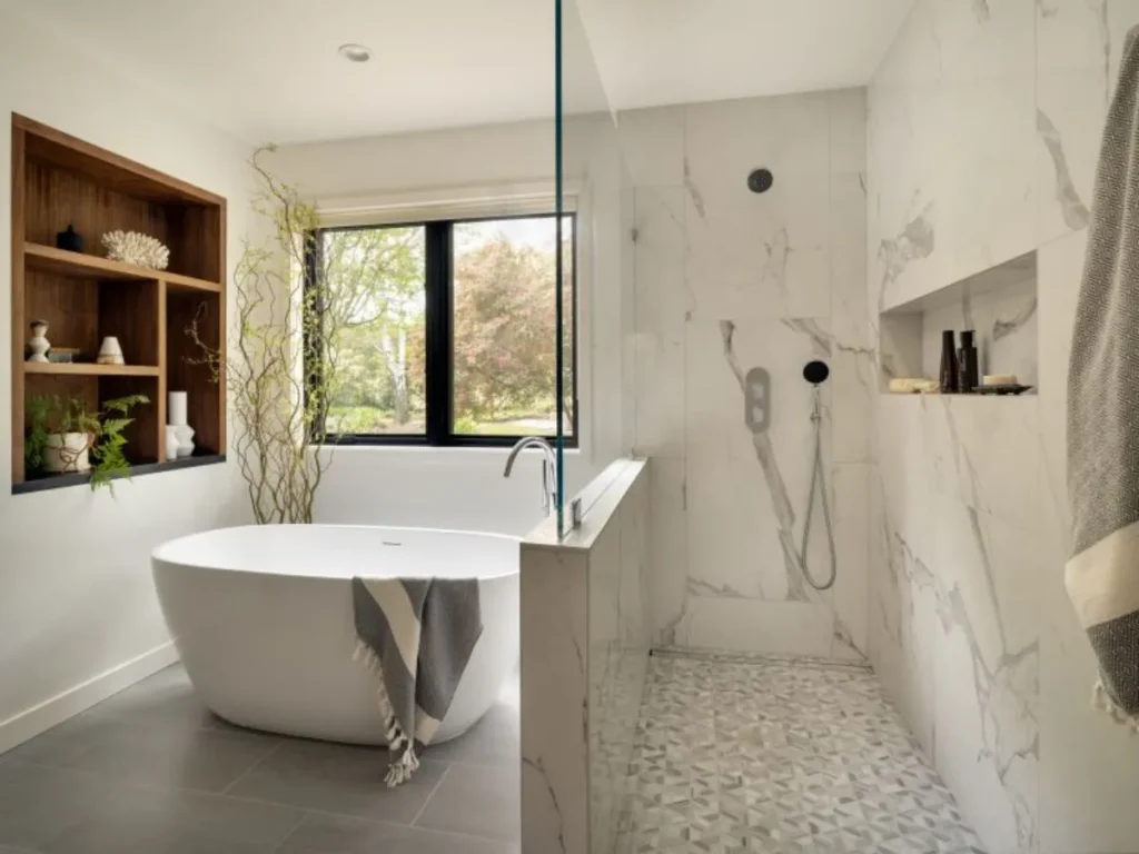 Contemporary bathroom with freestanding bathtub and glass shower.