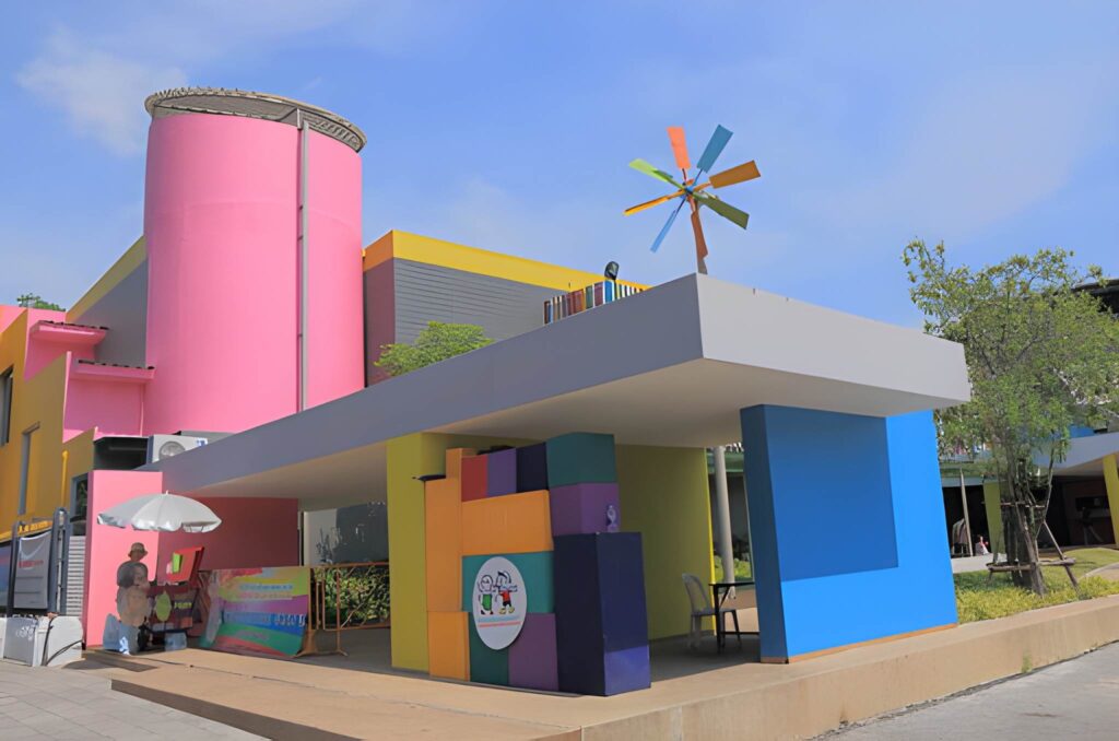 Colorful modern architecture with bright pink, blue, and yellow elements.