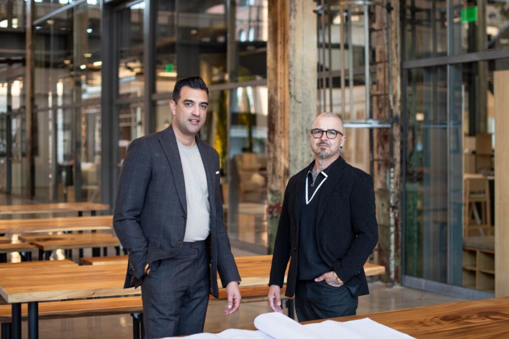 Two men in professional attire in a modern office.