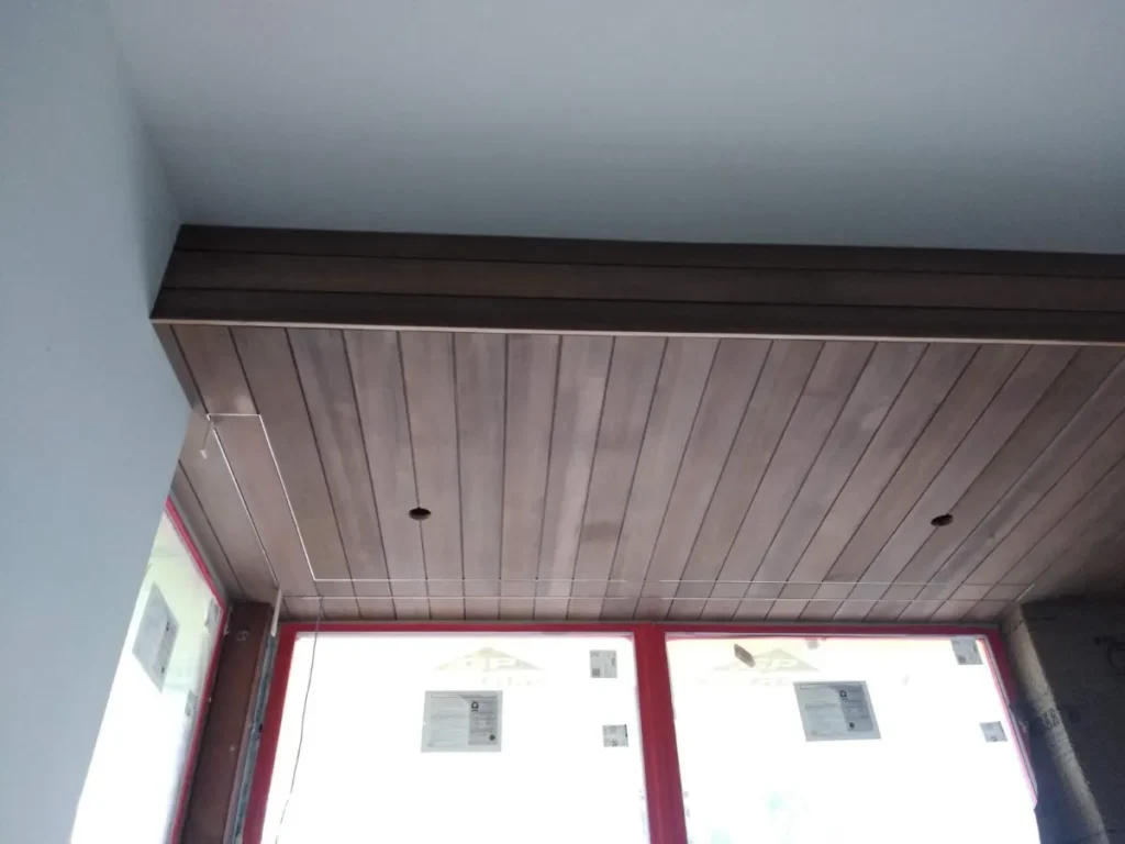 Wooden slatted ceiling with clean lines.