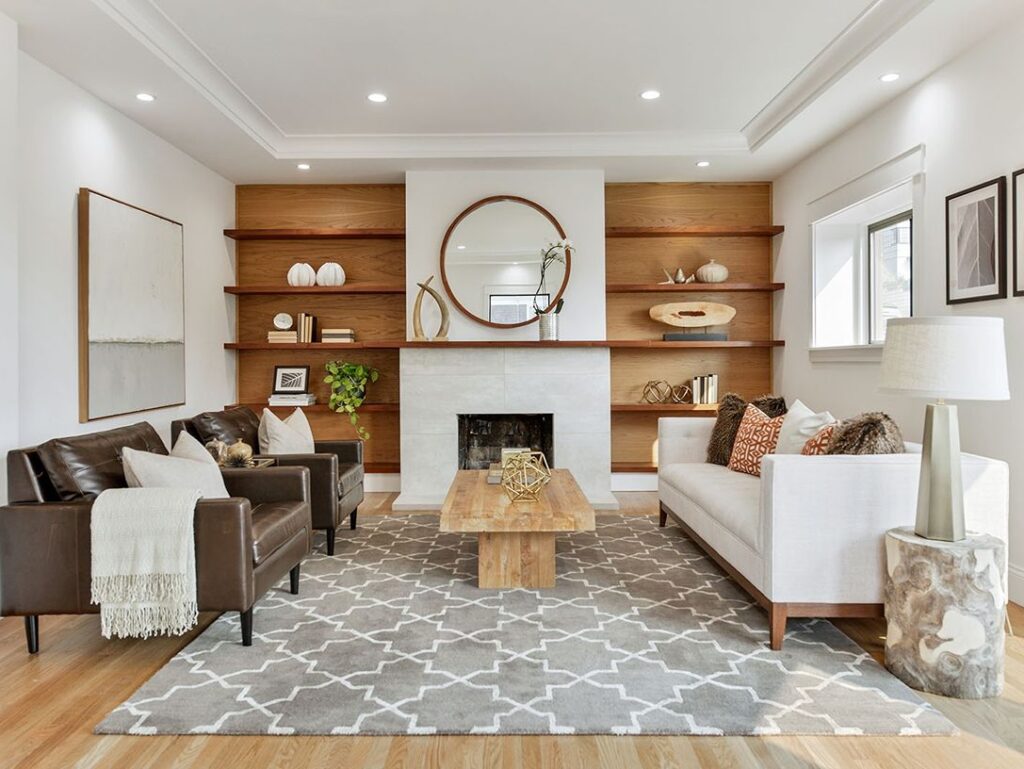 Cozy living room with fireplace and round mirror