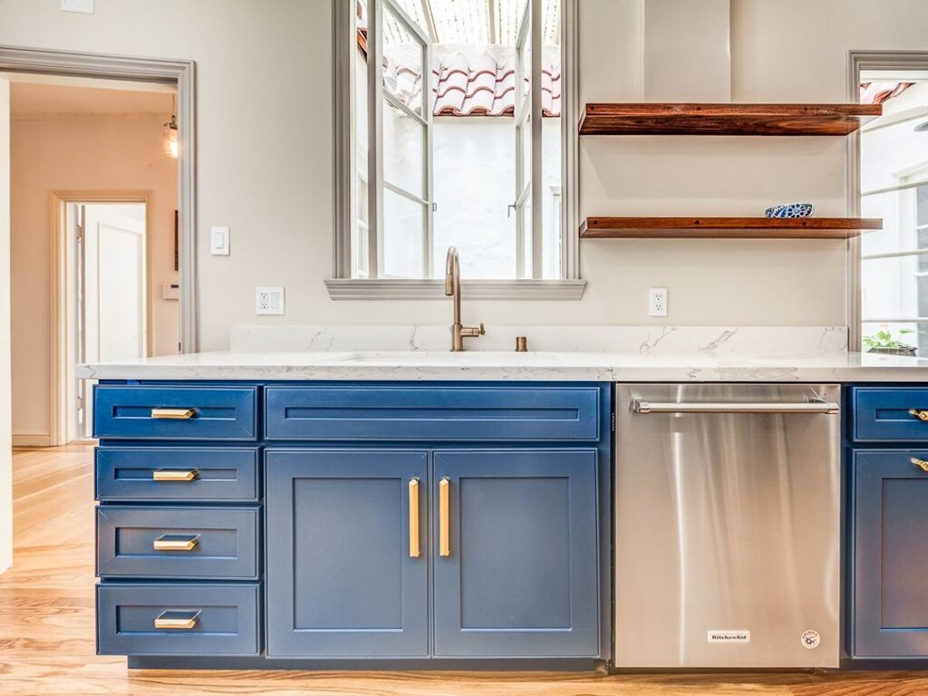 Blue and white kitchen with open shelving