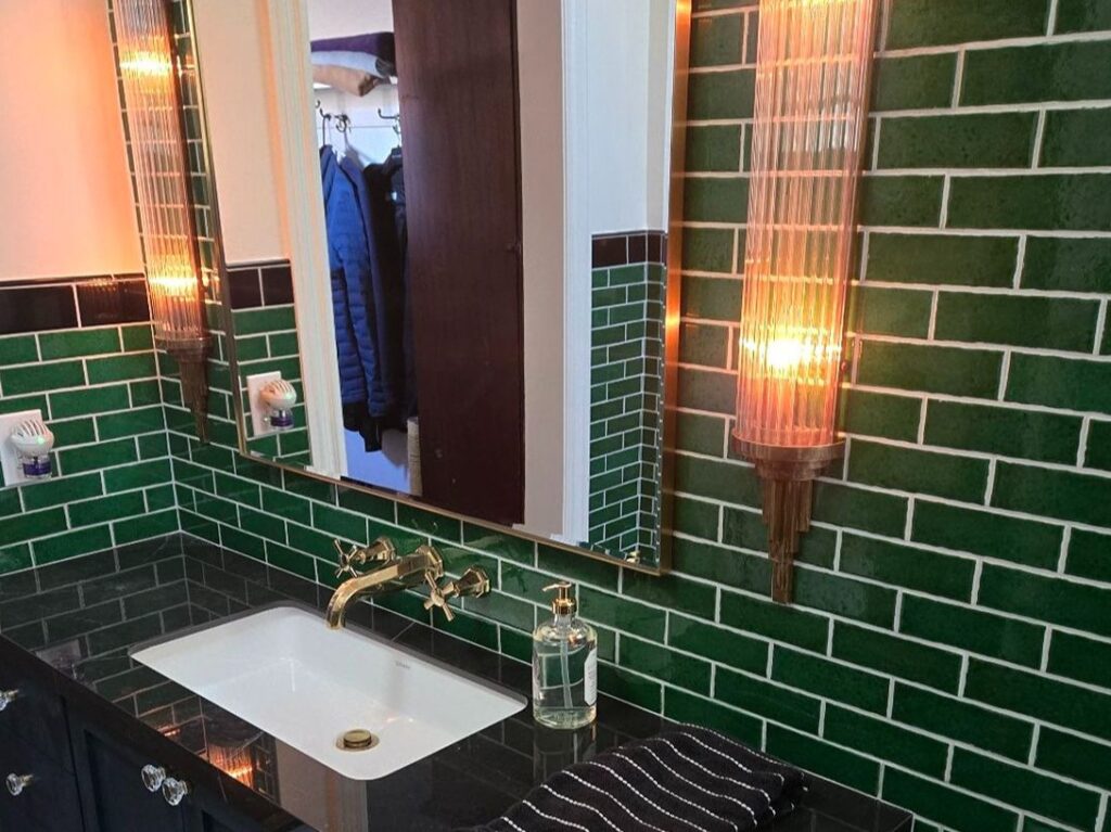 Close-up of exterior with green brick.