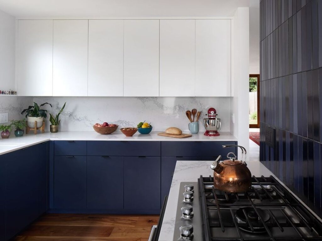 Kitchen with white and navy blue cabinets