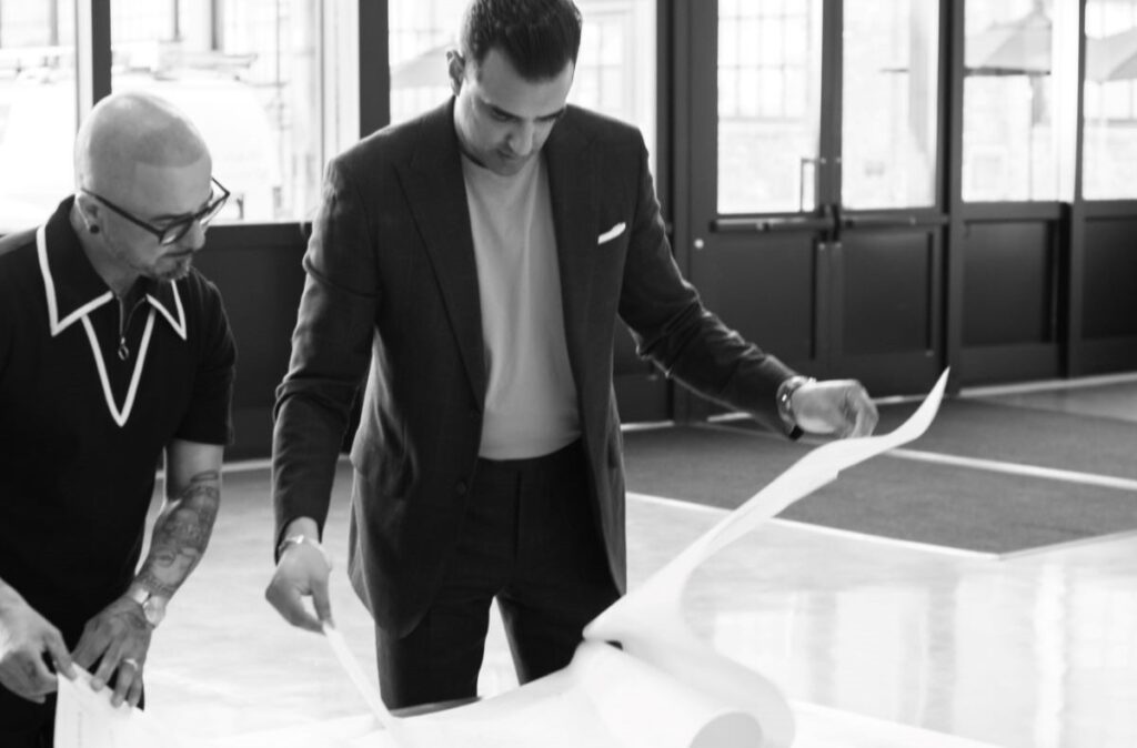 Black and white image of man in suit.