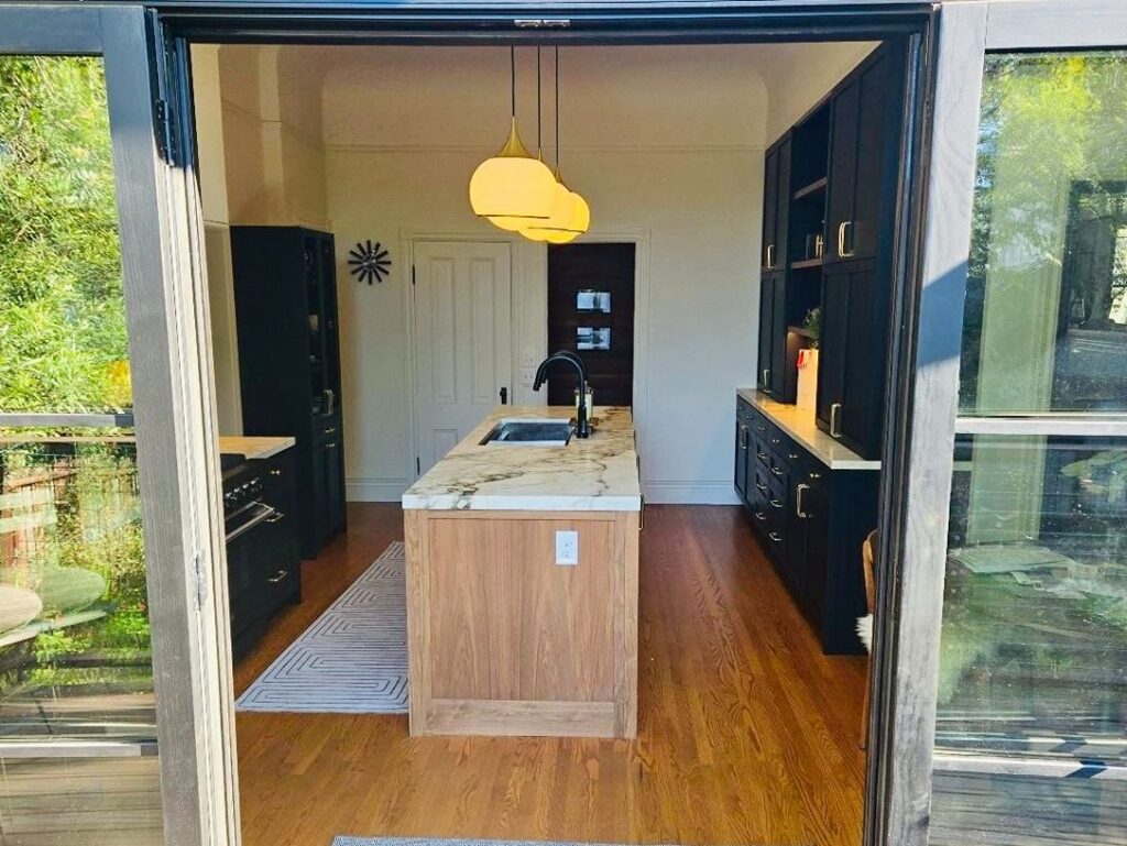 Open kitchen with minimalist design and island.