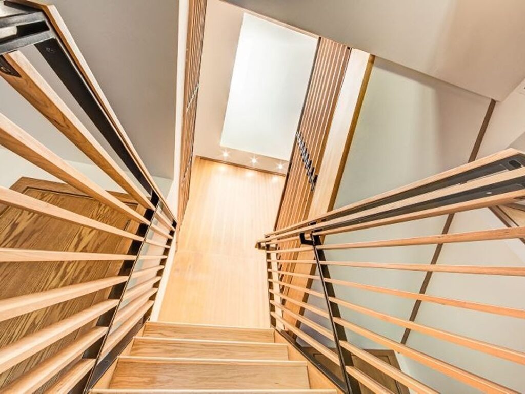 Wooden staircase with natural light from above