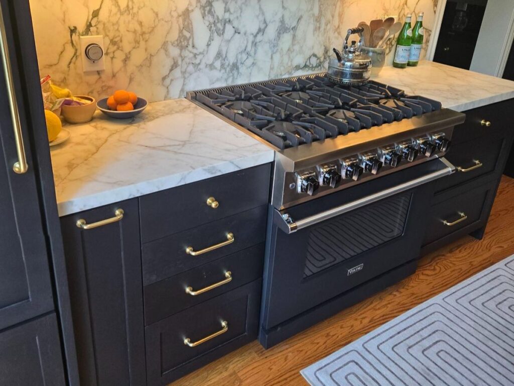 Blue kitchen cabinets with gas range