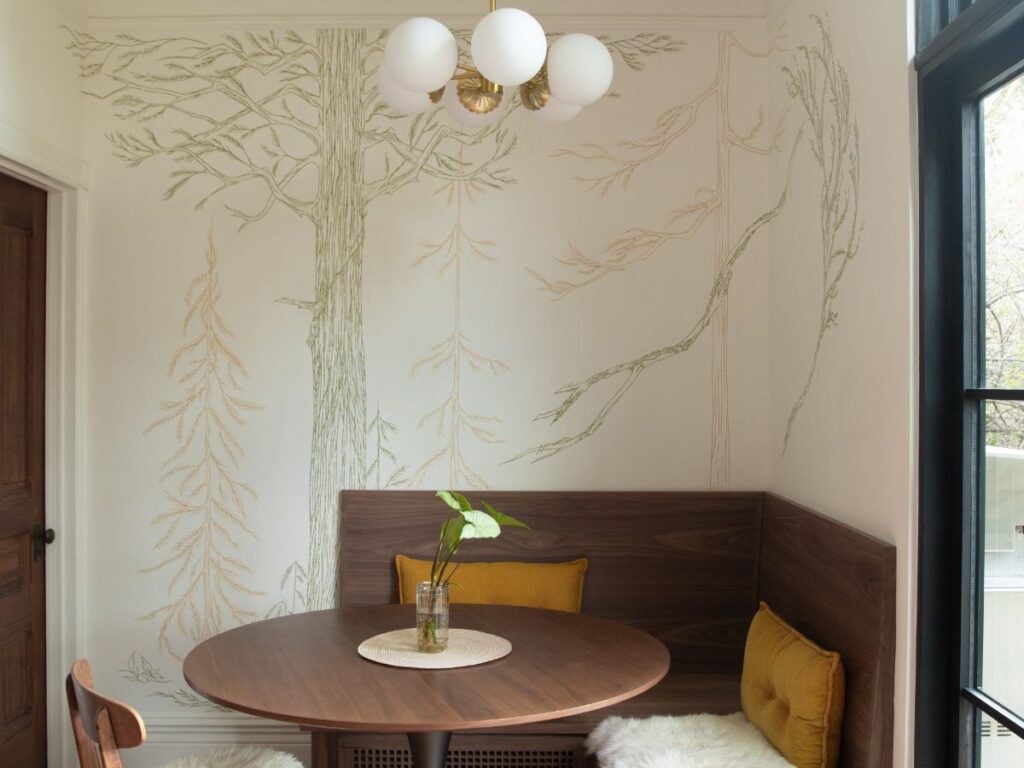 Cozy breakfast nook with wall mural
