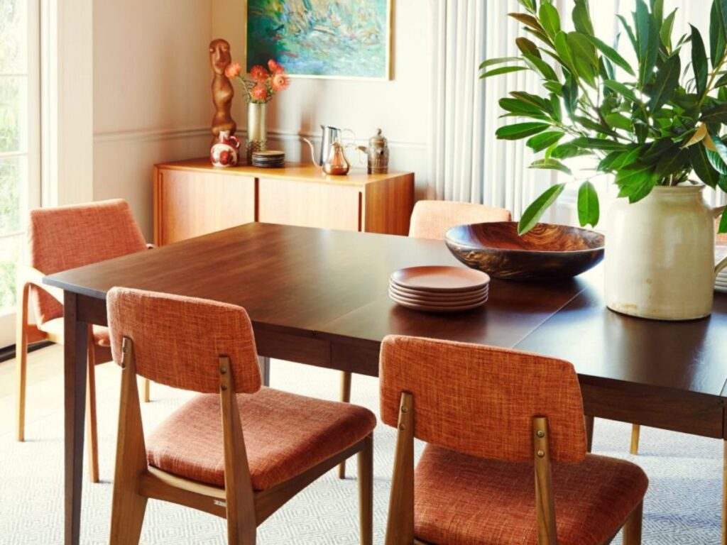 Dining room with wooden chairs and plants
