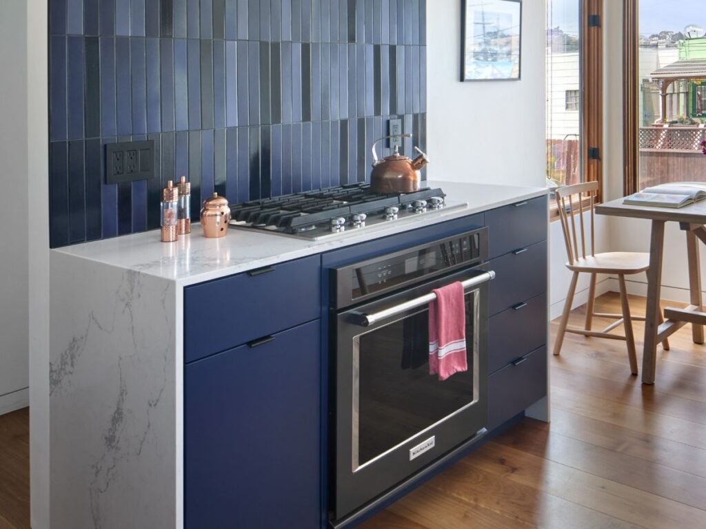 Modern kitchen with dark tile backsplash