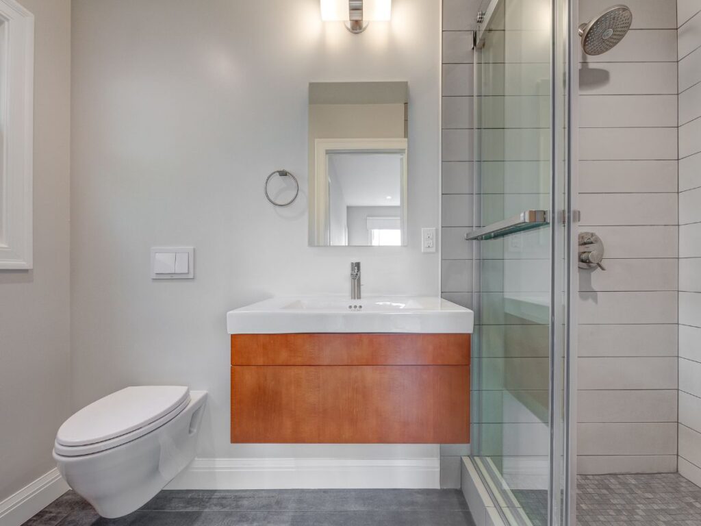 Bright bathroom with glass shower and vanity