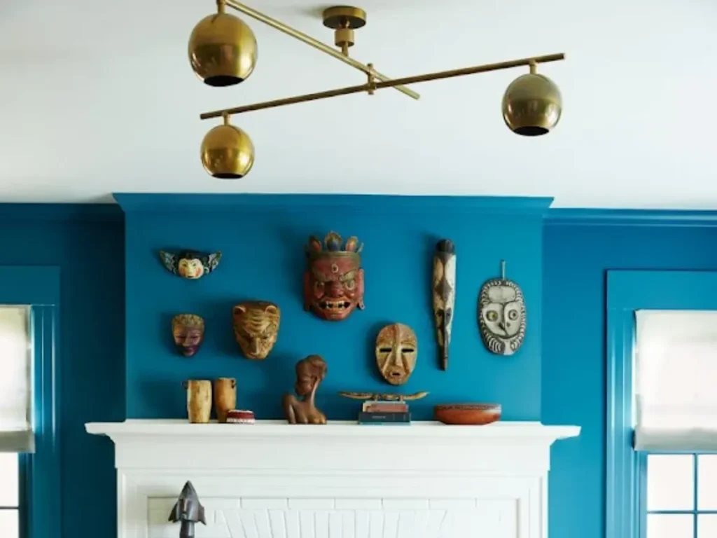 Wall display of masks above mantel