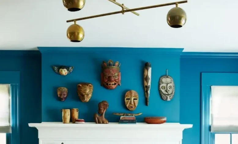 Wall display of masks above mantel